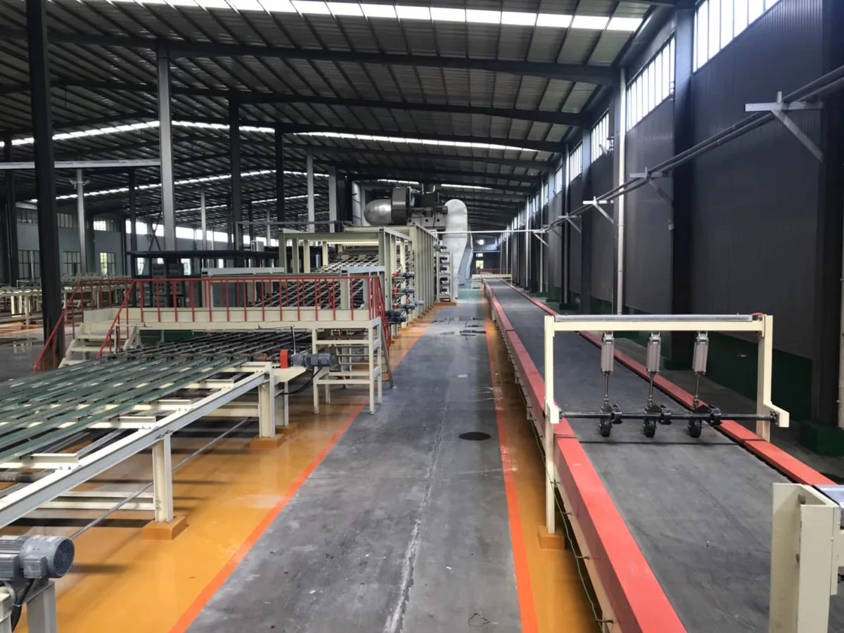Gypsum board production machinery inside a factory